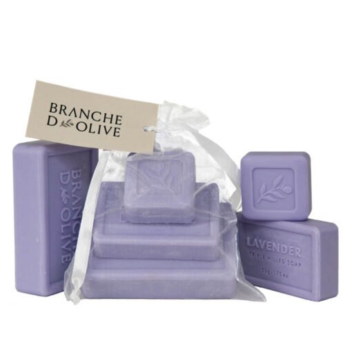 Branche d'Olive Lavender Mauve Soap Steps, three sizes of soap stepped on each other bagged and tagged with display Lavender Mauve Soap as a backdrop