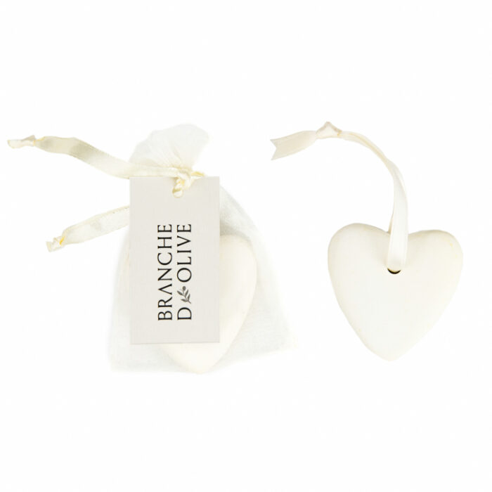 Branche d'Olive ceramic heart on a satin hanging ribbon shown bagged and unbagged against a white background.
