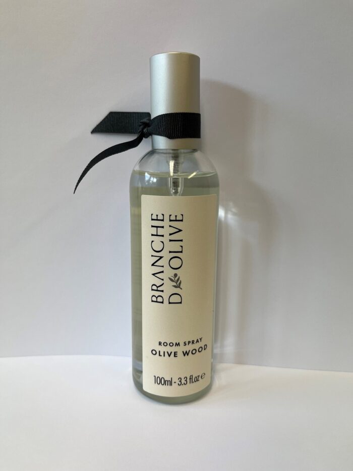 Olive Wood Room Spray - 100ml shown capped with black ribbon against a grey background