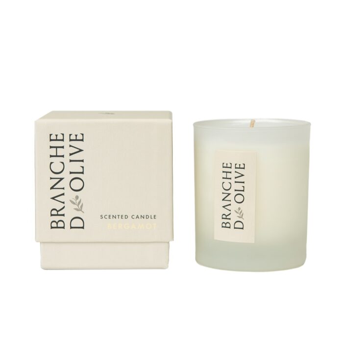 Branche d'Olive Bergamot candle sitting beside its box.