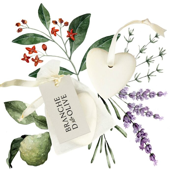 Branche d'Olive scented heart shaped ceramic shown bagged and tagged against a hand drawn coloured image of the constituent ingredients
