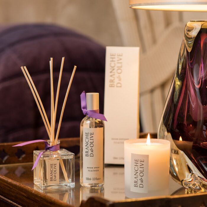 Branche d'Olive display of Lavender products including a diffuser, candle and room spray beside a purple vase