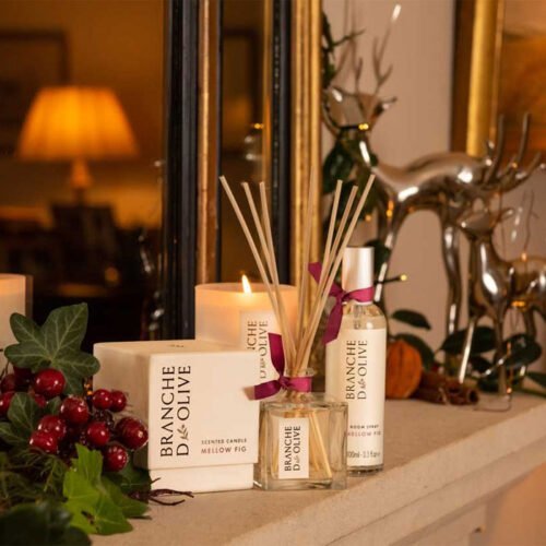 Branche d'Olive Mellow Fig Scented Candle, Diffuser, Candle and Room Spray on a Christmas decorated mantle piece