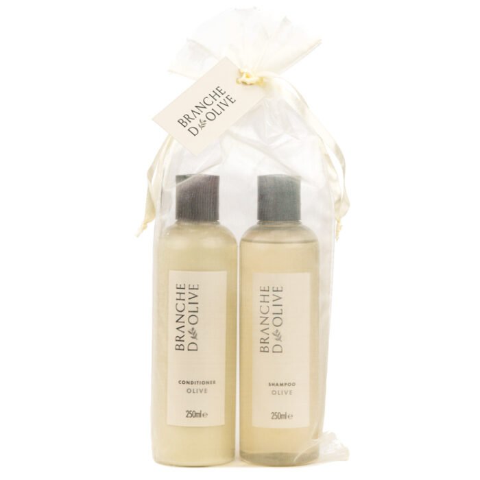Bottles of Branche d'Olive Olive fragranced Shampoo and Conditioner in a cream drawstring bag